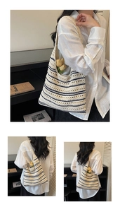 Detail of crochet striped tote bag showing woven texture and spacious casual design