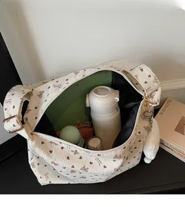 Interior view of spacious corduroy tote bag showing large capacity for umbrella and books