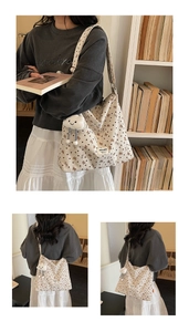 Close-up of beige corduroy tote bag with bear print and soft cloud plush pendant