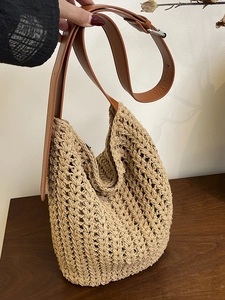 Minimalist woven tote bag in beige with brown adjustable shoulder strap for women