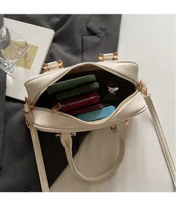 Top-down view of spacious off-white boston bag interior showing large storage capacity