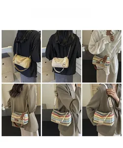Detail showing multi-color rainbow woven bucket bags with elegant metal chain straps