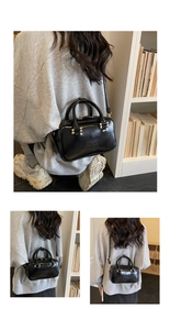 Detailed views of a black bowling handbag with gold hardware and embossed text on display