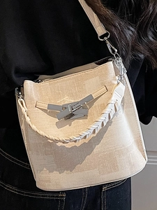 Fashionable beige bucket shoulder bag with marble print and silver metallic buckle