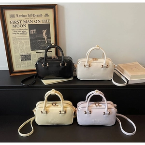 Boston style handbags in four colors with embossed logo and gold hardware detail