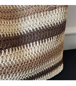 Close-up of horizontal striped straw weaving pattern in dark brown and beige tones