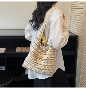 Detailed view of handmade woven hollow out tote bag with striped texture design