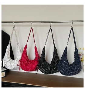 Polka dot canvas crescent bags in four colors with drawstring pleated sides