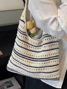 Women's crochet straw bucket bag with navy stripes and hollow knit texture