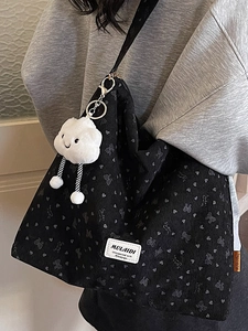 Vintage corduroy tote bag in black with grey heart patterns and cute plush cloud charm