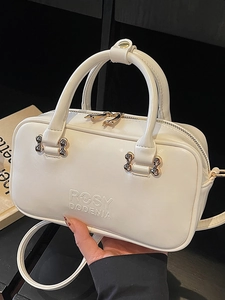Elegant white Boston handbag with gold hardware and Rosy Dodenia embossed logo detail