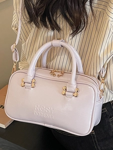 Glossy light purple Boston bag for women with metallic hardware and sleek top handle