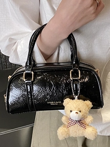 Chic black wrinkled patent leather Boston bag for women with cute plush bear charm