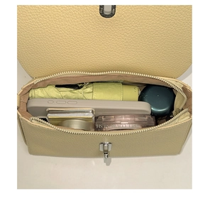 Vertical top view showing interior compartments of the yellow leather square crossbody bag