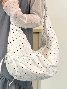 Minimalist white polka dot crescent shoulder bag with a large capacity and zipper