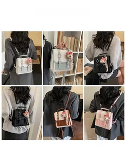 Detail view of stylish square crossbody bags in various colors with cute plush bear charms