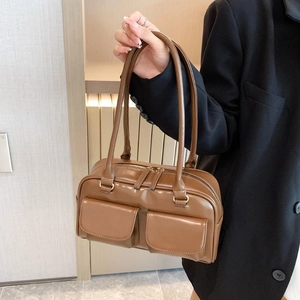 Brown faux leather shoulder bag with utility pockets and twin handles for work