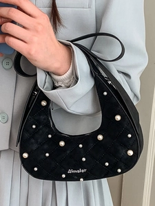 Chic black crescent handbag with quilted velvet texture and elegant white pearls decoration