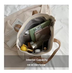 Macro view of large beige tote bag interior capacity with organized daily essentials