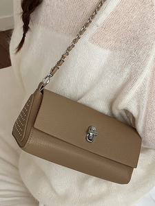 Brown lychee leather crossbody bag with silver hardware and chain strap for women