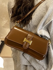 Retro brown faux leather underarm bag with a golden H buckle and slim shoulder strap