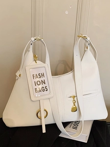 Sac sous le bras minimaliste en cuir blanc avec finitions dorées et forme trapèze