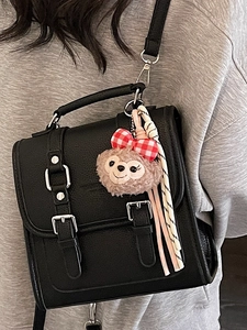 Trendy black mini square backpack with vintage buckle and plush bear charm for women