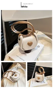 Three perspectives of a mini heart crossbody bag in cream and coffee PU leather