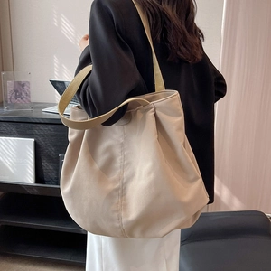 Large beige nylon tote bag with leather strap and top handle for women in business style