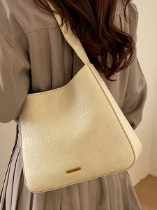 Cream white retro tote bag with pleated leather texture and wide shoulder strap