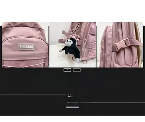 Pink nylon backpack detail showing logo, mesh side pocket and plush gorilla pendant