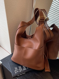 Classic brown pebble leather hobo shoulder bag for women with adjustable strap and front pocket
