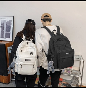 Detail view of high-capacity nylon backpack with multi-pocket design and street style look