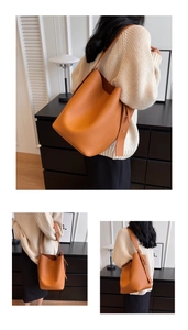Vue détaillée du sac seau marron caramel en cuir grainé avec large bandoulière