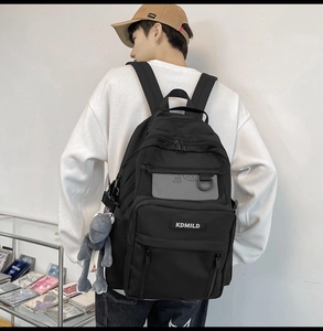 Detail view of large capacity black backpack featuring functional mesh pockets and stylish compartments