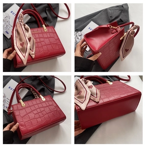Detailed views of red crocodile-patterned PU leather tote with woven handle and silk scarf