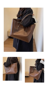Detailed view of dark brown leather tote bag featuring refined brand embossing and metal rivets