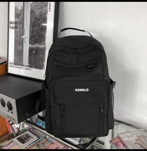 Multi-compartment black waterproof backpack with front zipper pockets and side mesh pockets