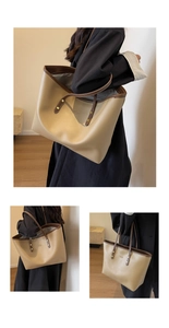 Detail view of khaki tote bag with dark brown trim and golden metal rivet accents