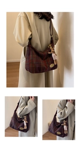 Detail of wool plaid shoulder bag with vintage gold nameplate and cute rabbit charm
