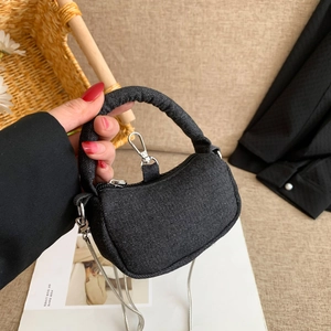 Minimalist dark grey denim crossbody bag with silver chain strap and top handle
