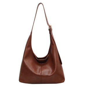 Large dark brown vintage hobo bucket bag in soft textured leather with adjustable strap