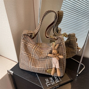 Classic brown plaid woolen shoulder bag with cute plush bunny charm and golden hardware