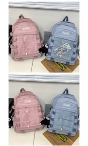 Detail of trendy nylon backpack with mesh pockets, elastic crisscross cords and side buckle