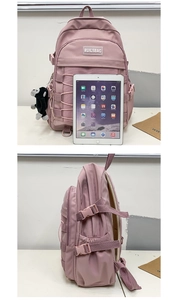 Pink purple backpack with black gorilla pendant showing size comparison with an iPad
