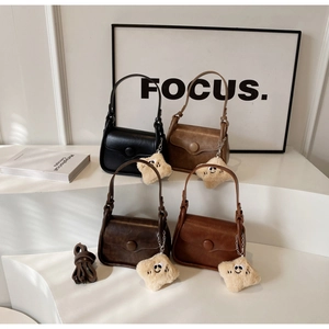 Detail of vintage square purses in four colors with star charms and straps