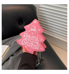 Detail of pink Christmas tree crossbody bag with Merry Christmas text and silver chain