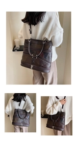 Detail view of brown tote bag with multi-zipper pockets and vintage leather texture