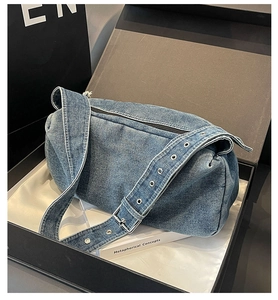 Blue denim pillow bag in a black gift box with silk lining for stylish gift presentation