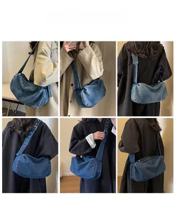 Multi-angle views of a blue denim crossbody bag with adjustable metallic eyelet strap